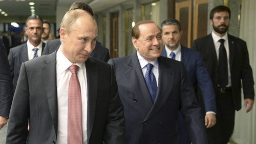 资料图：意大利前总理贝卢斯科尼与俄罗斯总统普京。
